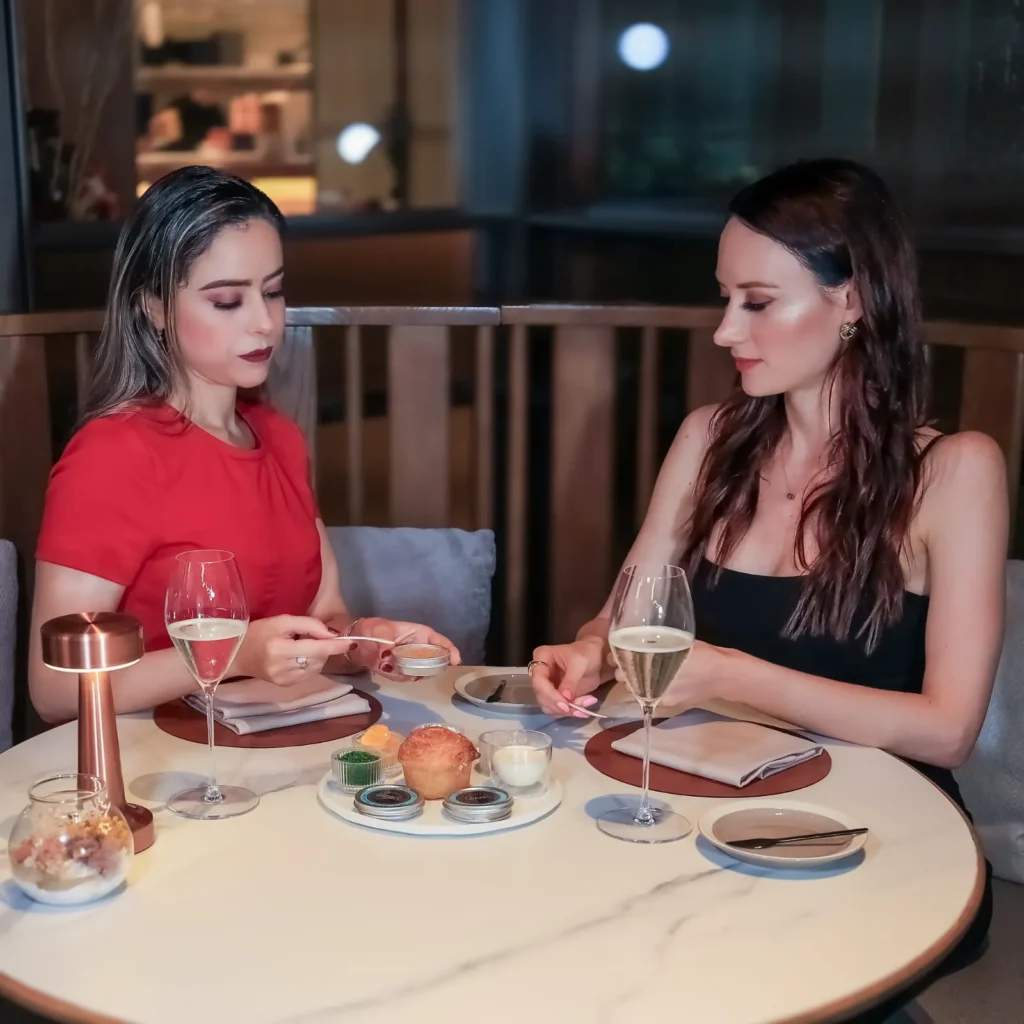 Two clients at a caviar masterclass by a world of caviars