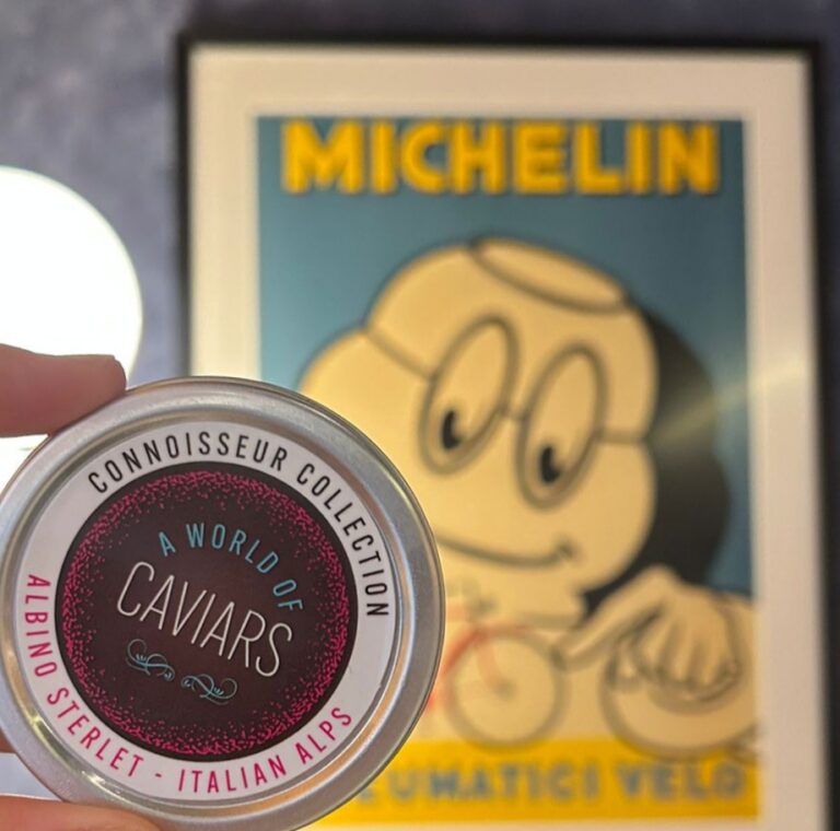 A world of caviars albino caviar held in front of Michelin poster to represent the brand as luxury